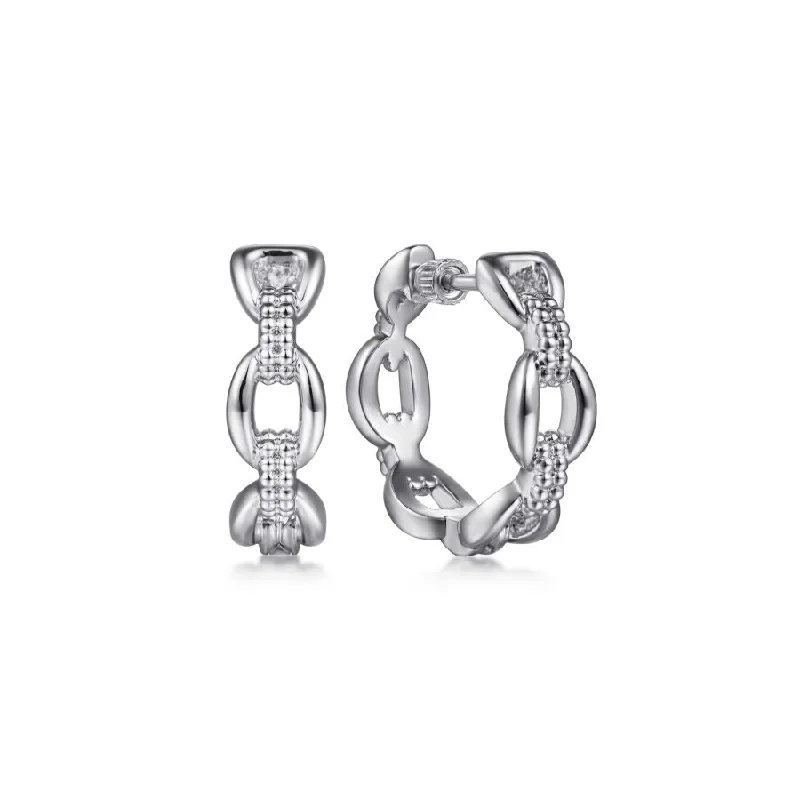 Solitaire diamond engagement ring with a platinum setting for a classic and elegant lookChain Link Hoop Earrings in Sterling Silver