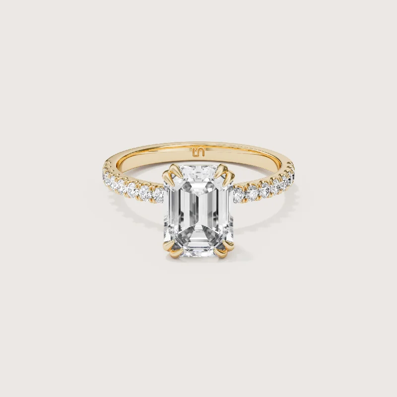 Round - cut diamond engagement ring with a twisted band design in 14K white goldLotus Emerald Solitaire - Diamond Band