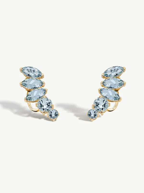 Halo diamond engagement ring in 18K white gold with a center oval - cut stoneIsadora Earrings With Blue Aquamarine Gemstones In 18K Yellow Gold