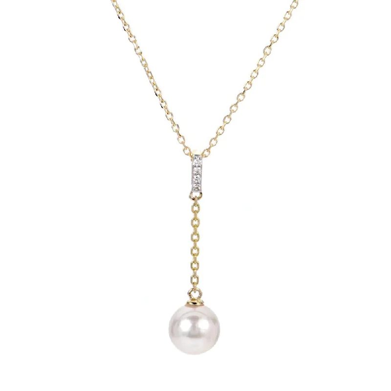 Round - cut diamond engagement ring with a twisted band design in 14K white goldAkoya Pearl and Diamond "Y" Necklace