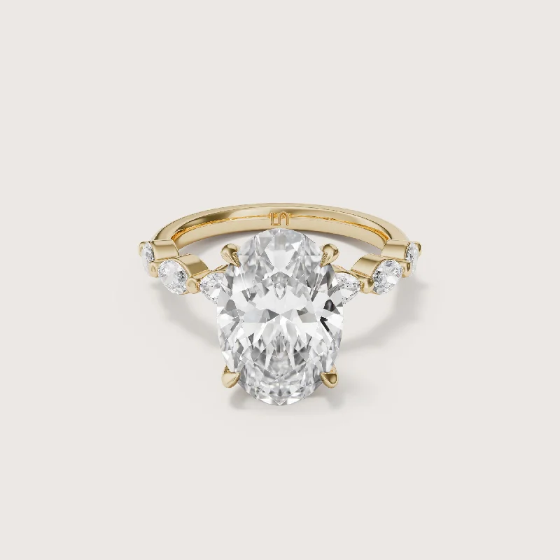 Pear - shaped diamond engagement ring with side baguette diamonds in 18K goldPetal Oval Solitaire Marquise Band