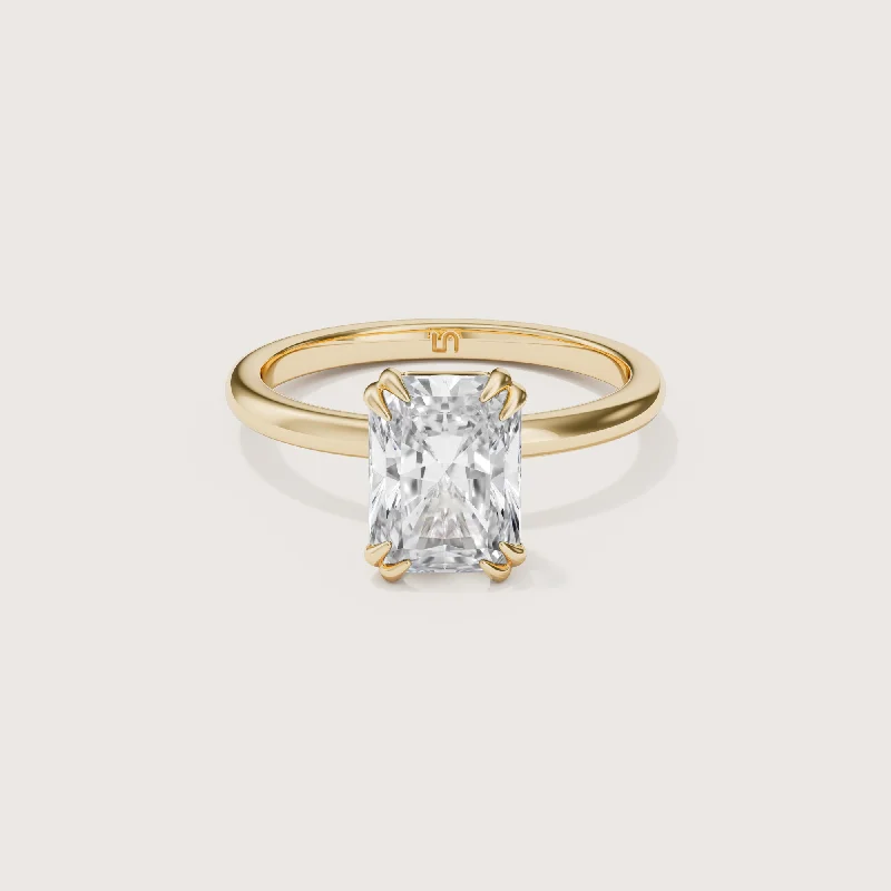 Radiant - cut diamond engagement ring with a bezel - set center stone in 18K yellow goldLotus Radiant Solitaire