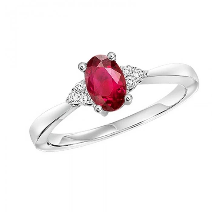 Ruby and diamond engagement ring with a halo of diamonds in 14K red goldOval-Shaped Ruby Ring with Trios of Side Diamonds