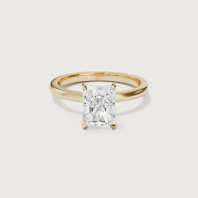 Round - cut diamond engagement ring with a twisted band design in 14K white goldAllegra Radiant Solitaire