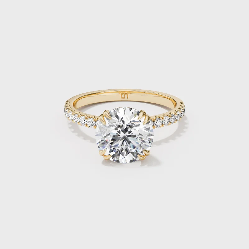 Ruby and diamond engagement ring with a halo of diamonds in 14K red goldLotus Round Solitaire - Diamond Band