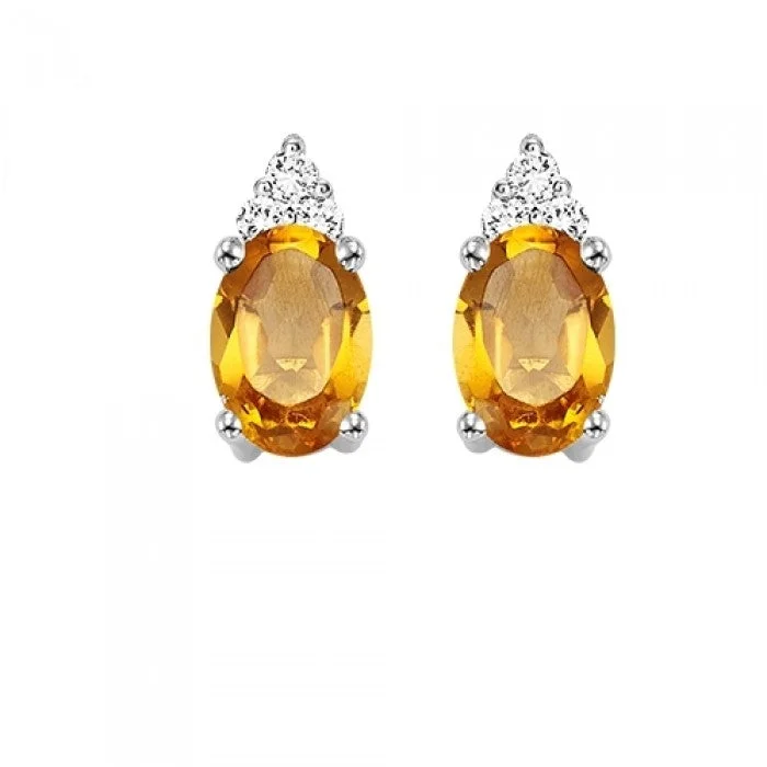 Emerald - cut diamond engagement ring set in a modern titanium bandCitrine Stud Earrings with Diamonds