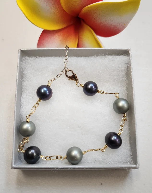 Geometric - Shaped Bangles in Matte Black for a Minimalist AestheticGreen Swarovski and Black Tahitian Bracelet - 12mm Black Tahitian and Purple Swarovski Pearls