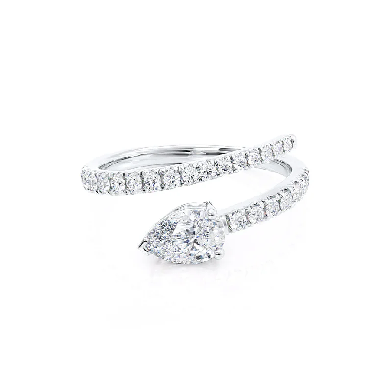 Cluster Engagement Rings with Multiple Small Diamonds Arranged in a Stunning DesignCELESTINE - Pear Moissanite Split Shank Ring 18k White Gold